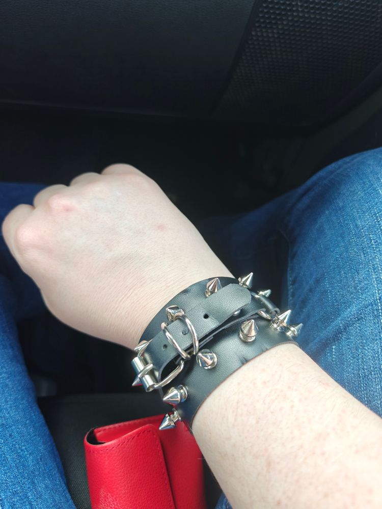 Photo of my right wrist, showcasing a spiked bracelet