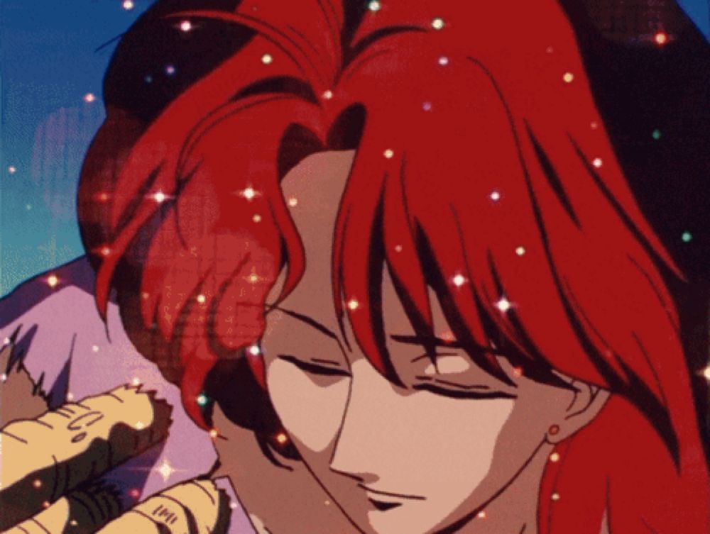 a close up of a person 's face with red hair and the word love on the bottom