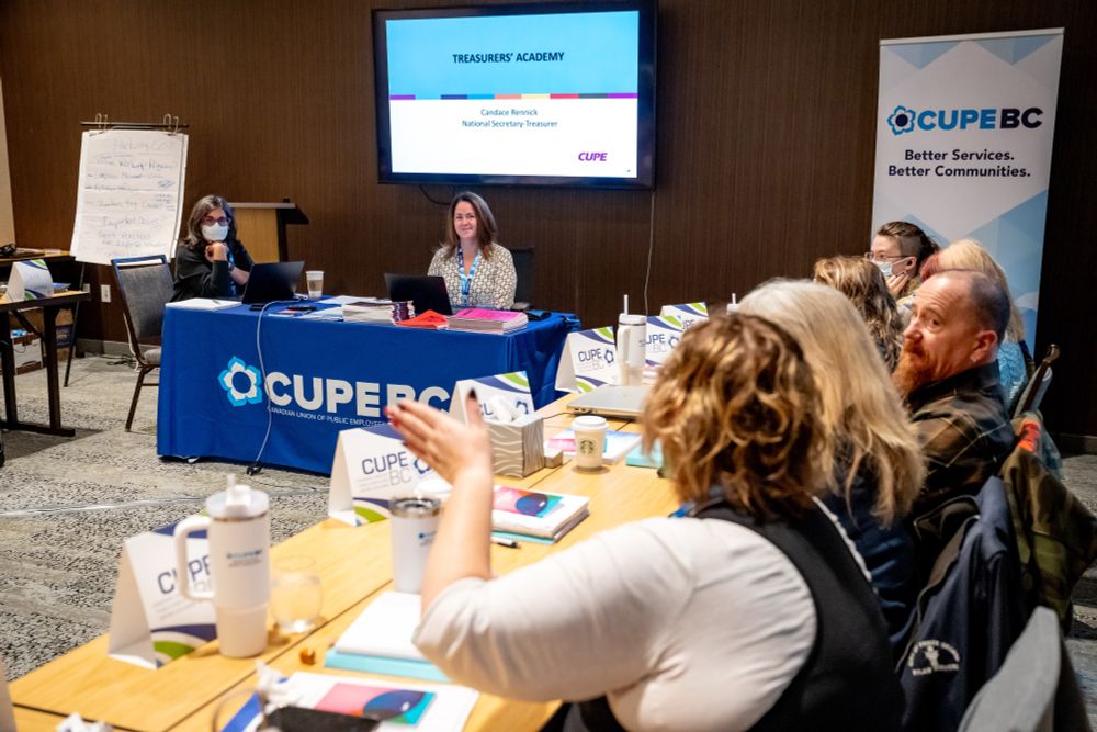 Group of adults in a seminar room for a workshop