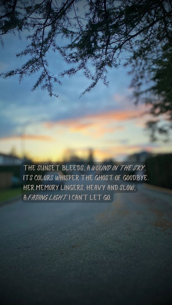 A breathtaking sunset framed by tree branches, symbolizing love and loss. The text reads, “The sunset bleeds, a wound in the sky… a fading light I can't let go.”
