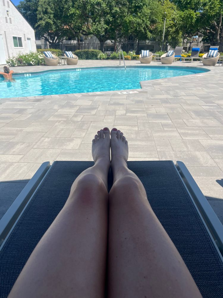 Chelsea’s hot dog legs by a pool.