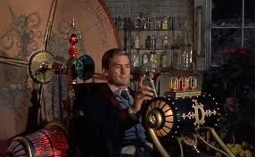 Rod Taylor riding the steampunk time machine in THE TIME MACHINE.