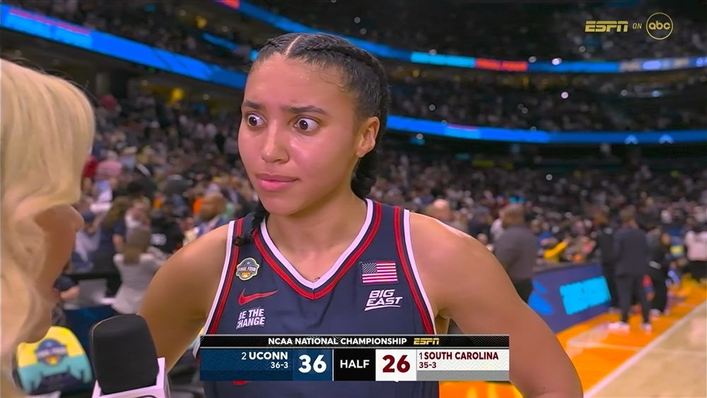 Azzi looking incredulously at Holly Rowe with her eyes bugged. 