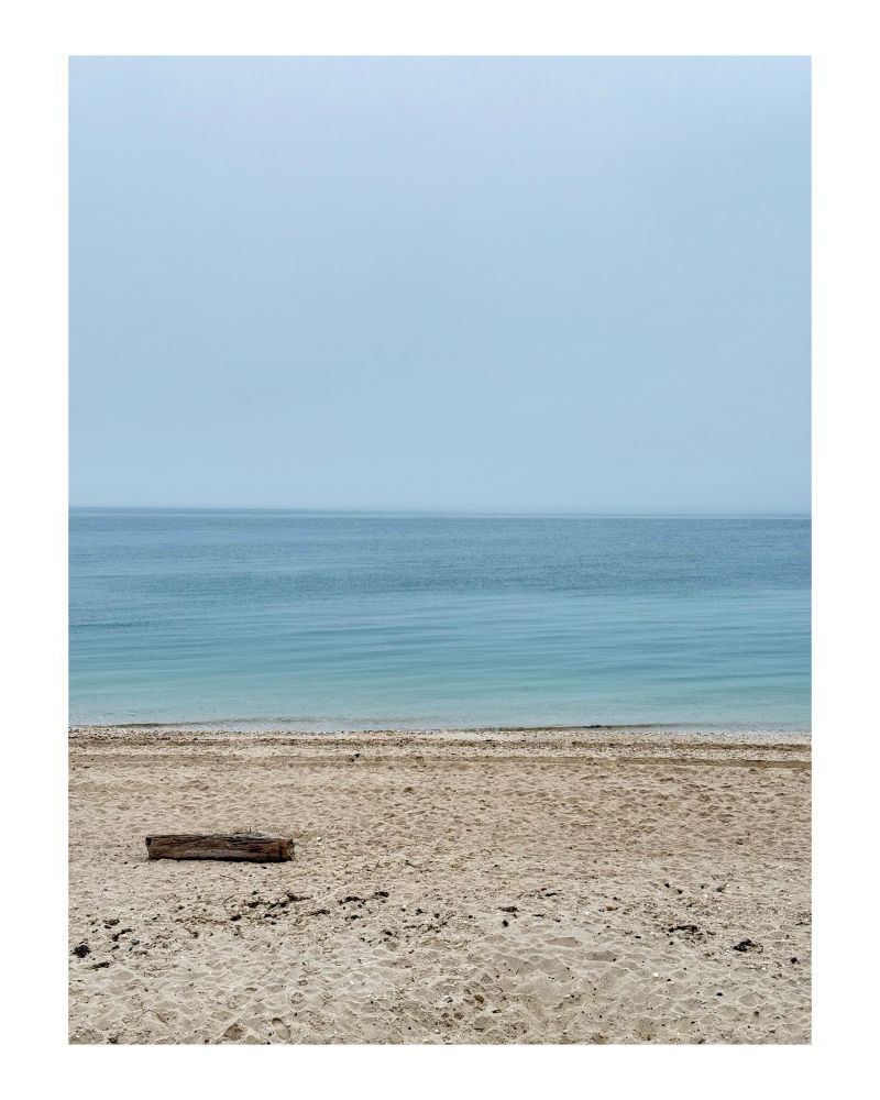 A beach with blue water.