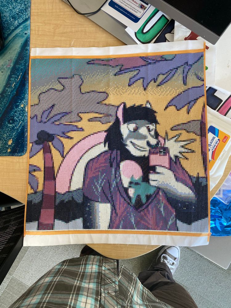 A diamond art page of rhaens fursona. It’s a horse with a nose ring taking a selfie in the tropics with a tropical shirt. The base art is made by one of the horse’s favorite artists