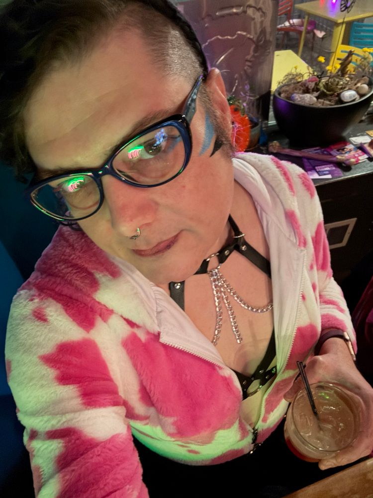 Samantha selfie in a pink/white onesie & shark attack in hand