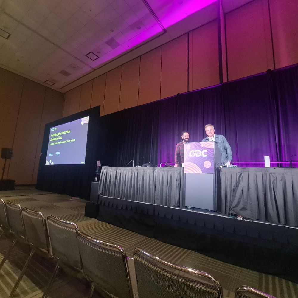 Photo of Angus and Aris on the GDC podium