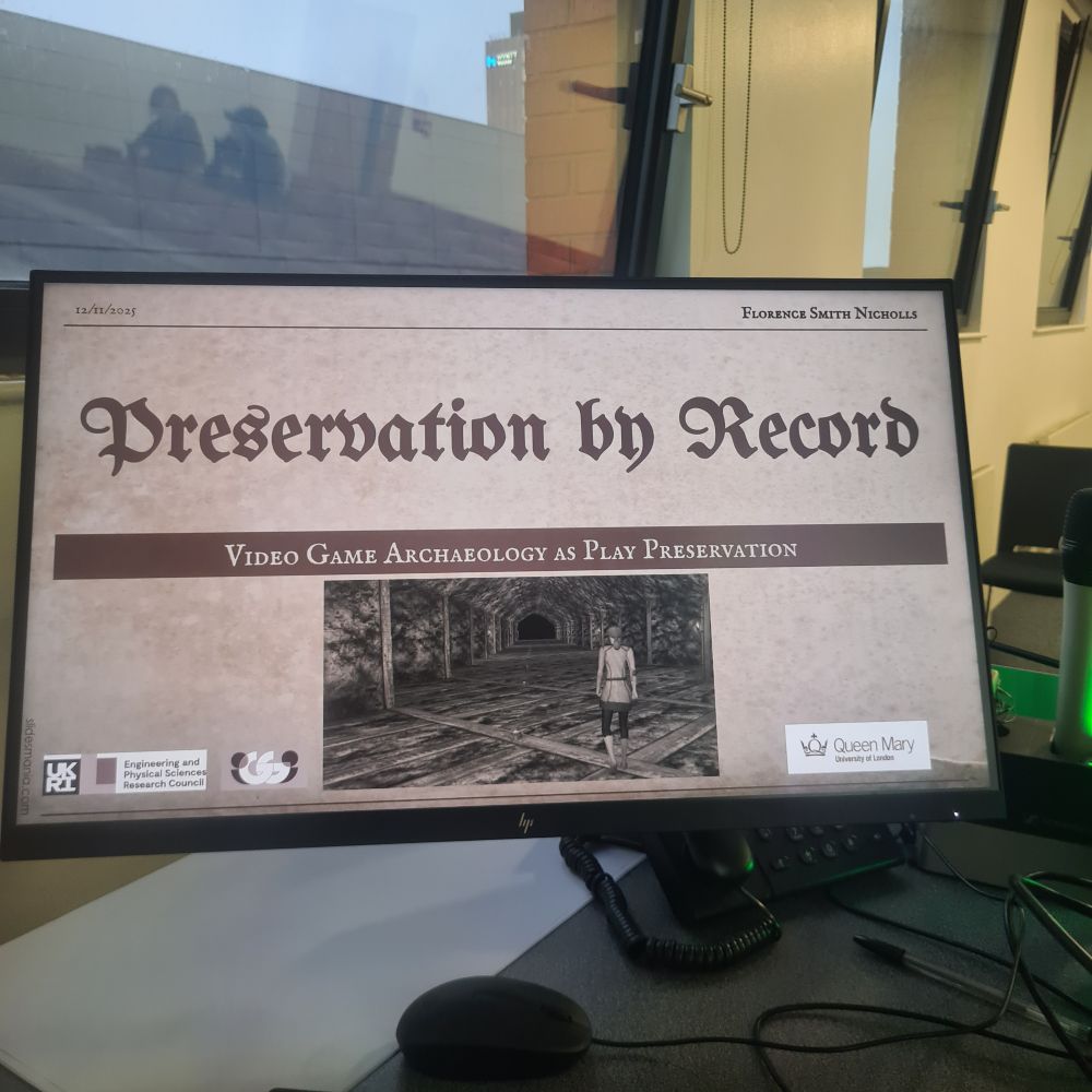Photograph of slide saying "Preservation by Record Video Game Archaeology ad Play Preservation"