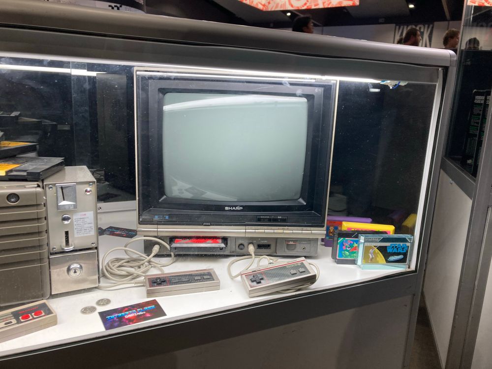 Sharp Famicom CRT TV with controllers and games