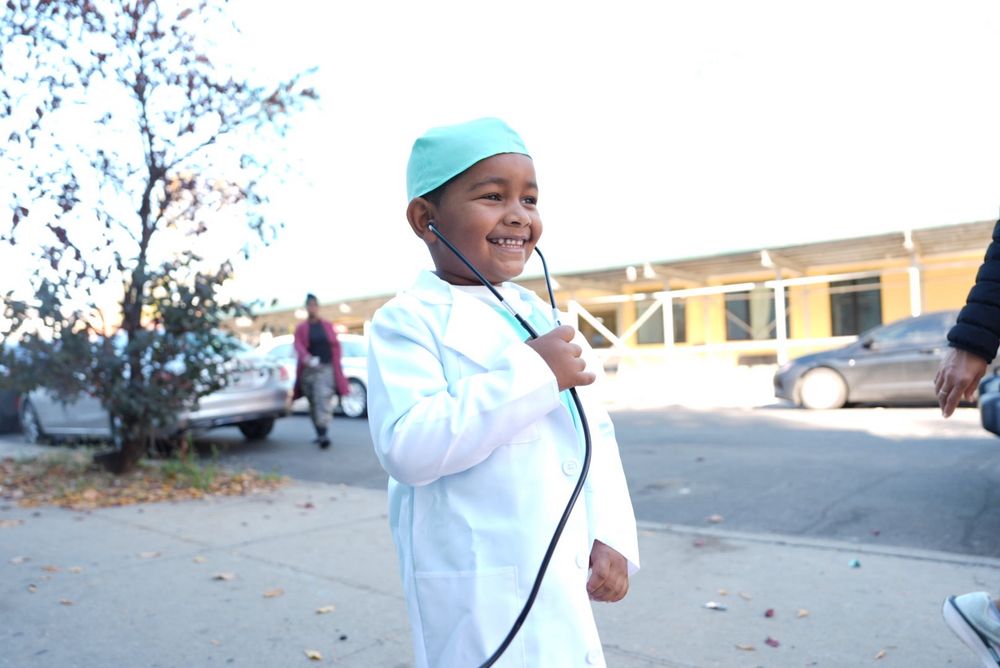 Chancellor Aviles-Ramos visits P.S. 345K for a Halloween celebration with students in costume.