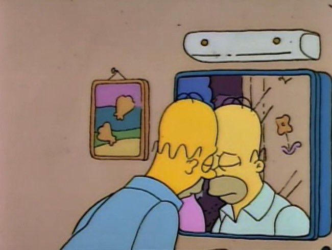 Homer Simpson sad leaning on mirror