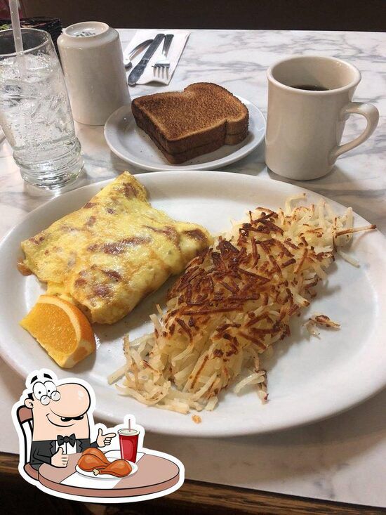 An omelette and hashbrowns with a slice of orange, two well toasted slices of toast and a cup of coffee
