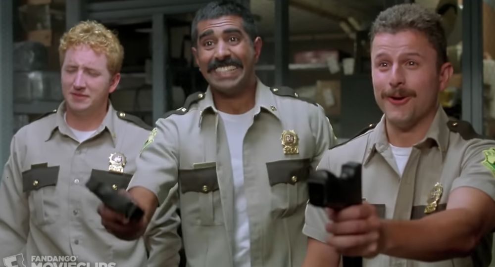 morons from supertroopers offering guns