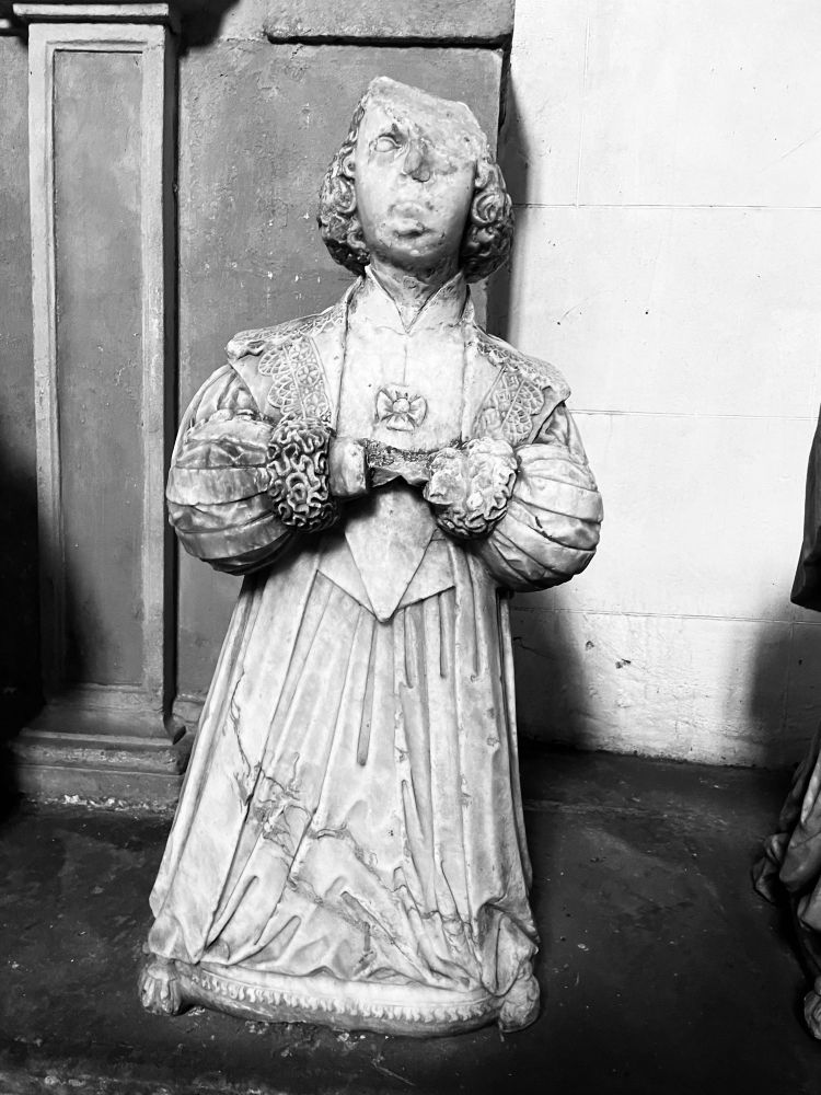 A marble carving of a praying figure at Culross Abbey 