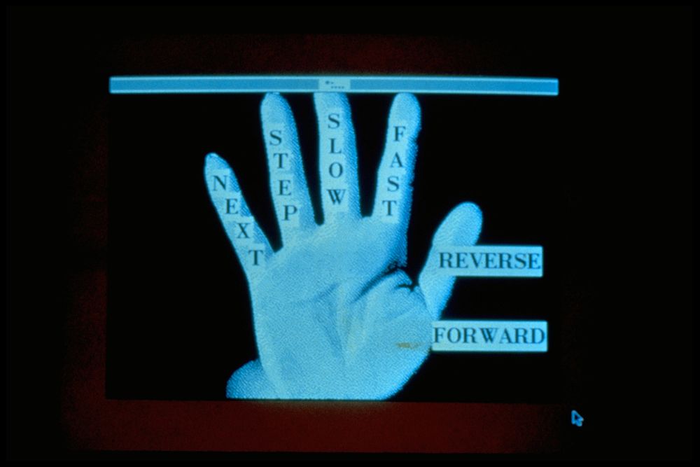 Deep Contact by Lynn Hershman Leeson, 1984-1989. Another laserdisc game wherein the player is invited to touch the body of a character named Marion, with different events unfolding based on your choices.