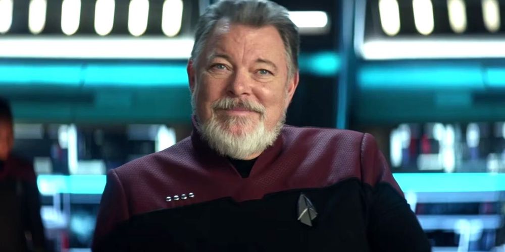 Captain William T Riker from the Season 1 finale of Star Trek Picard. He is wearing a new incarnation of the Starfleet Delta, which includes strange dark shapes behind the usual arrowhead design.
