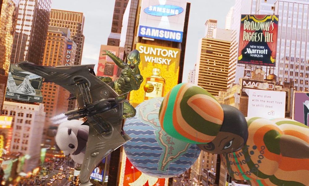 screenshot from the movie Spider-Man (2002) showing the Green Goblin flying through a parade of large balloons