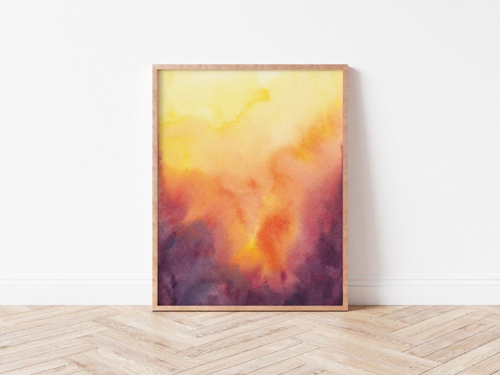 Vibrant yellows, oranges, and purples in abstract watercolor print, framed