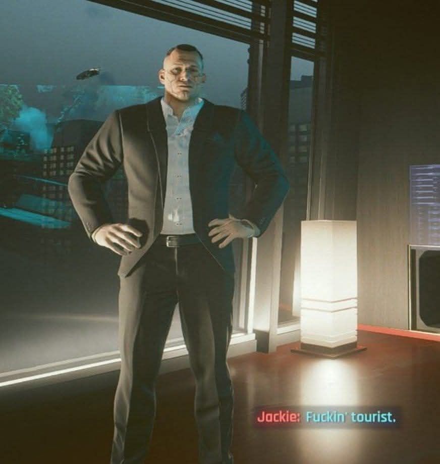 A picture of Jackie from Cyberpunk 2077 saying "Fuckin tourist"