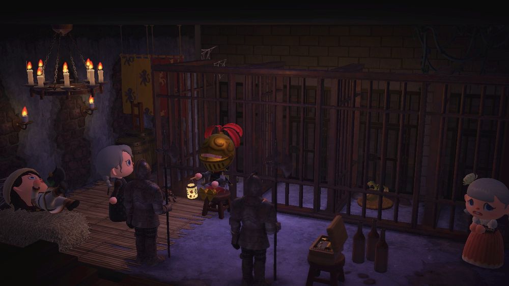 In Animal Crossing: New Horizons, four characters goof around a dimly lit medieval dungeon with several jail cells.