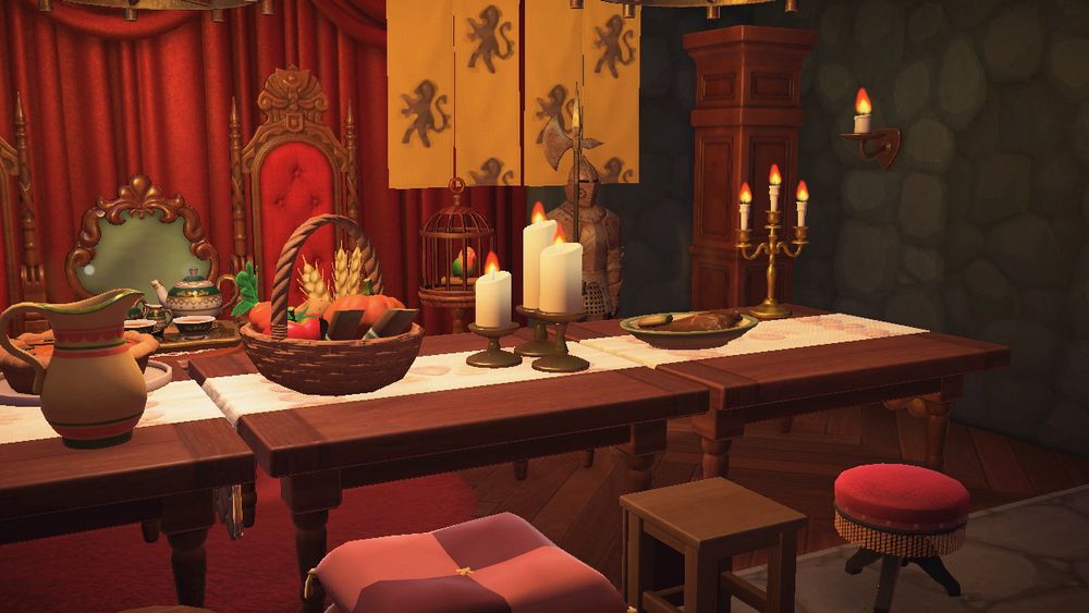 In Animal Crossing: New Horizons, a castle’s great hall and luxurious medieval feast. A close up shot of the table and seating.