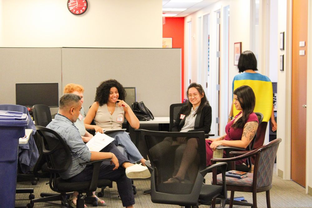 A photo of participants at the Asian American Federation’s member convening talking with each other.