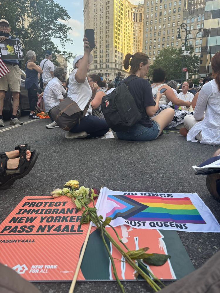 People sitting down at a Good Trouble demonstration.