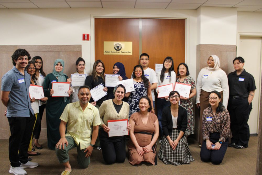 A group photo of Asian language interpreters.
