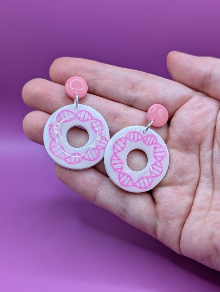 Pink dangly plasmid earrings