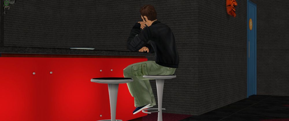 Claude sitting on bat stool while waiting for his drink. POV from behind.