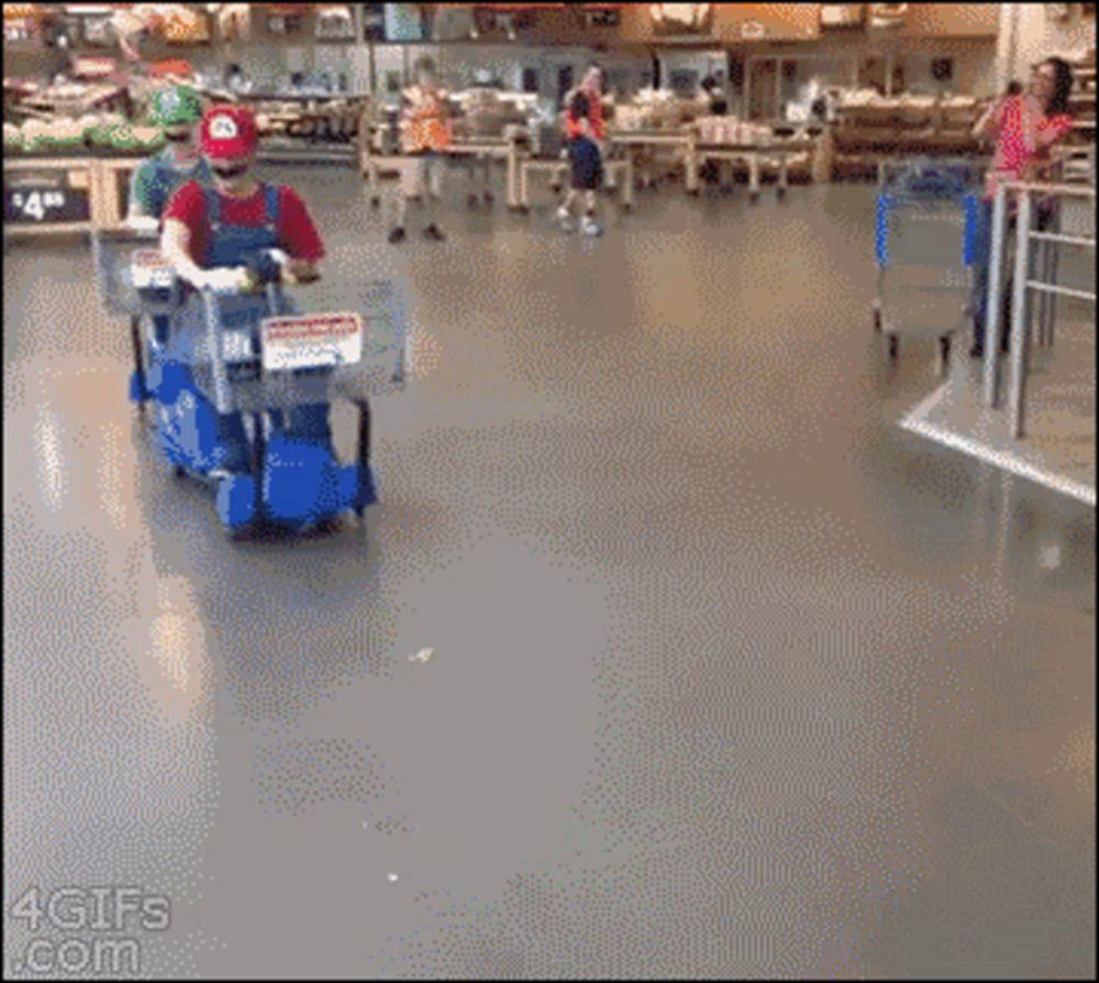 a man in a mario costume is pushing a cart in a store