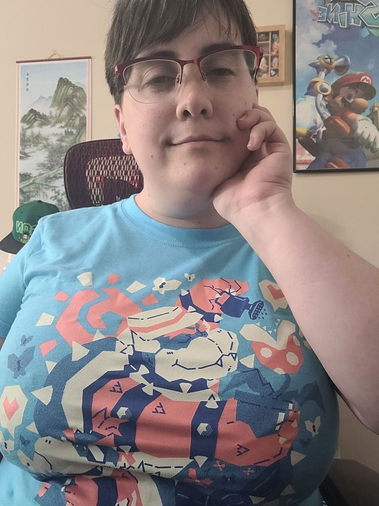 A selfie of Redria in a t.shirt where bowser is watering a piranha plant affectionately