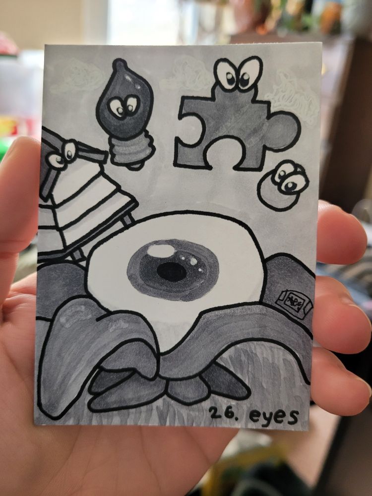 A physical trading card for StreamINK. Day 26. Eyes. Some assorted critters from Banjo Kazooie with cartoon eyes put on them