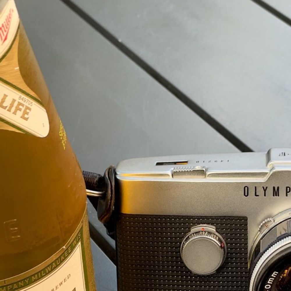 Christopher Chen on Instagram: "For those who haven’t handled an Olympus Pen F, here is mine (c.1964) + 40/1.4 G. Zuiko (c.1963-66) next to a High Life for scale. #beerandcamera #dccamerastyle #camera...