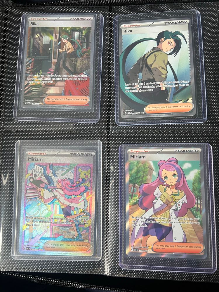 4 pokemon cards in toploaders. the first two are of rika, and the other two are of miriam.