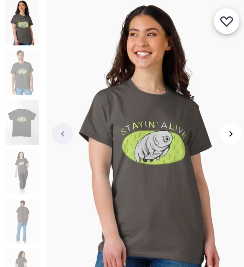 A white woman wearing a t-shirt design depicting a tardigrade with the text staying alive