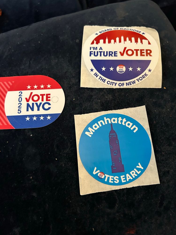 Three stickers handed out at the local polling place, all with different messages: Vote NYC, Manhattan Votes Early, I'm A Future Voter (?).