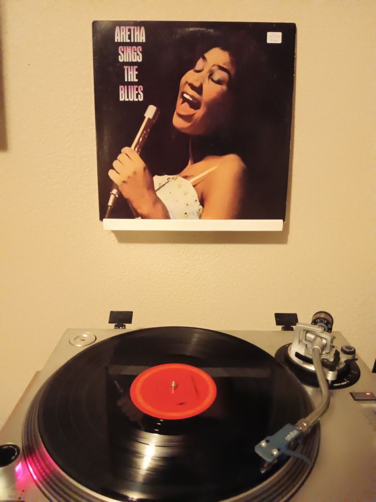 Record player with album cover for Aretha Franklin Aretha Sings The Blues