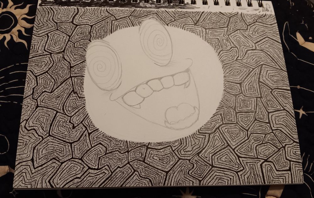 Micro marker on paper drawing of geometric trippy shapes with a big manic smile with swirly eyes in the middle 