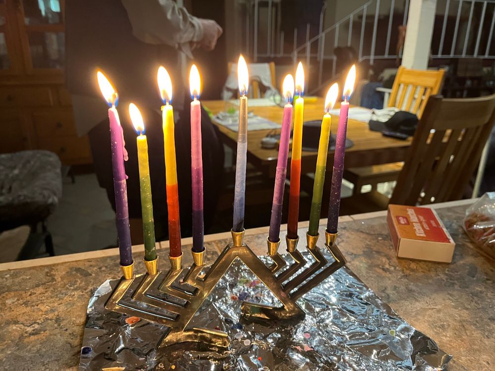Our menorah lit with 8 candles and the shamash in the middle