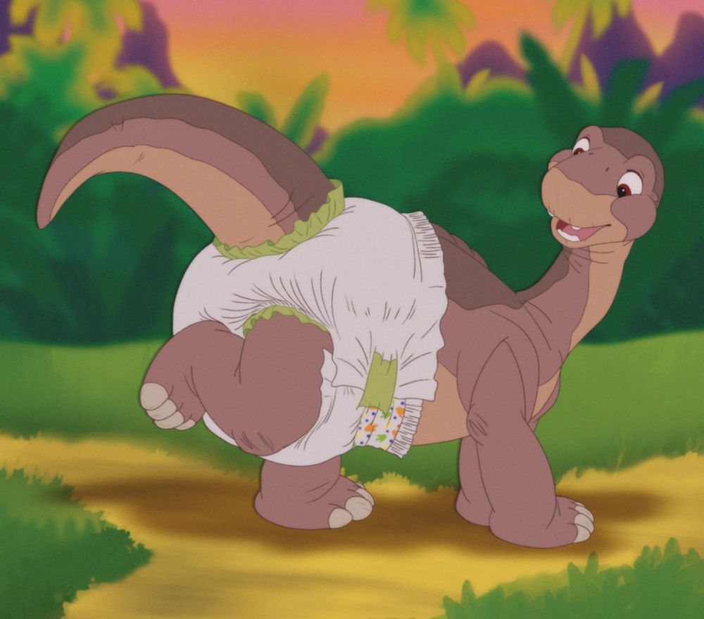 Littlefoot from Land Before Time in a diaper. One leg raised and looking back at it. Background is a forest/jungle.