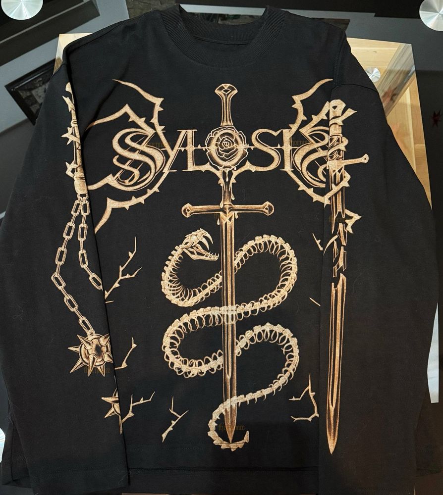 Photo of a black longsleeve with a design based on the metal band Sylosis, made with bleach. (Full front side + sleeves - final)