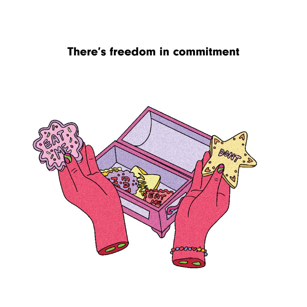 Two hands holding cookies with two different options. There’s freedom in commitment 