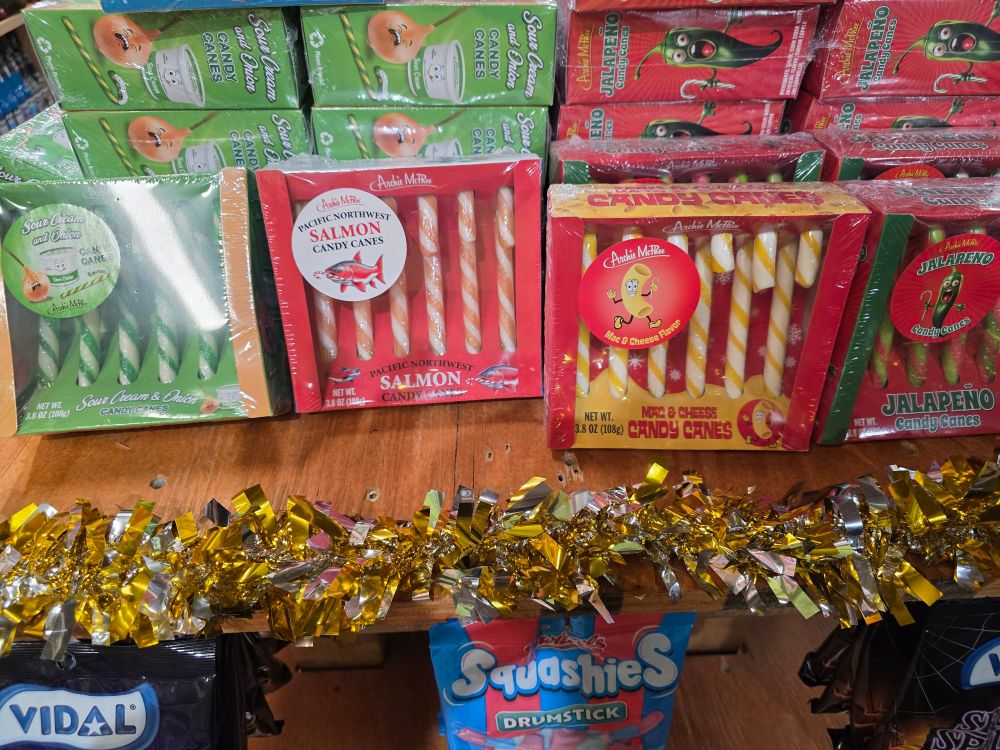 an assortment of candy canes that include flavors like sour cream & onion, salmon, and mac & cheese 