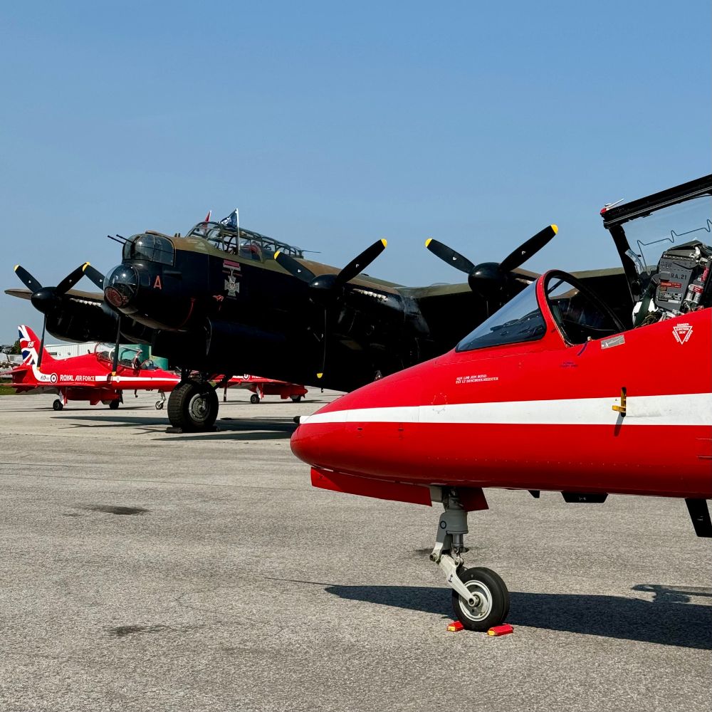 The nose of the CWHM Avro Lancaster and the nose of a RAF Red Arrow jet on the parking area.