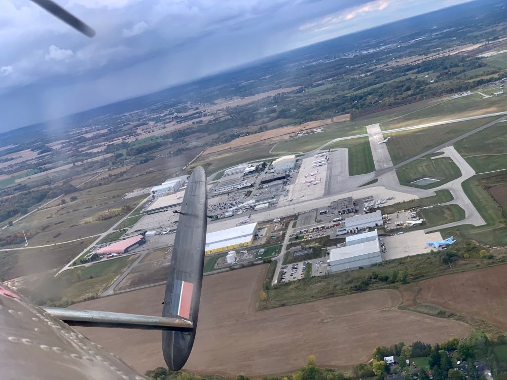 Looking towards an airport while banking inflight. 