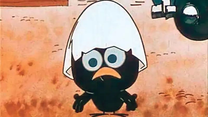 Calimero, un pollito negro con grandes ojos azules y un trozo de cáscara de huevo en la cabeza, hace un gesto como diciendo "pues ni idea".