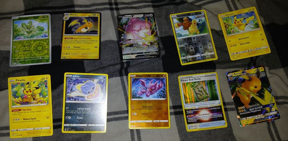 all of the cards: Sprigatito, raichu, blissy, bunneary, pikachu, a unique pikachu, inkay, gilgar (sp?), forest seal stone  and a Raichu GX