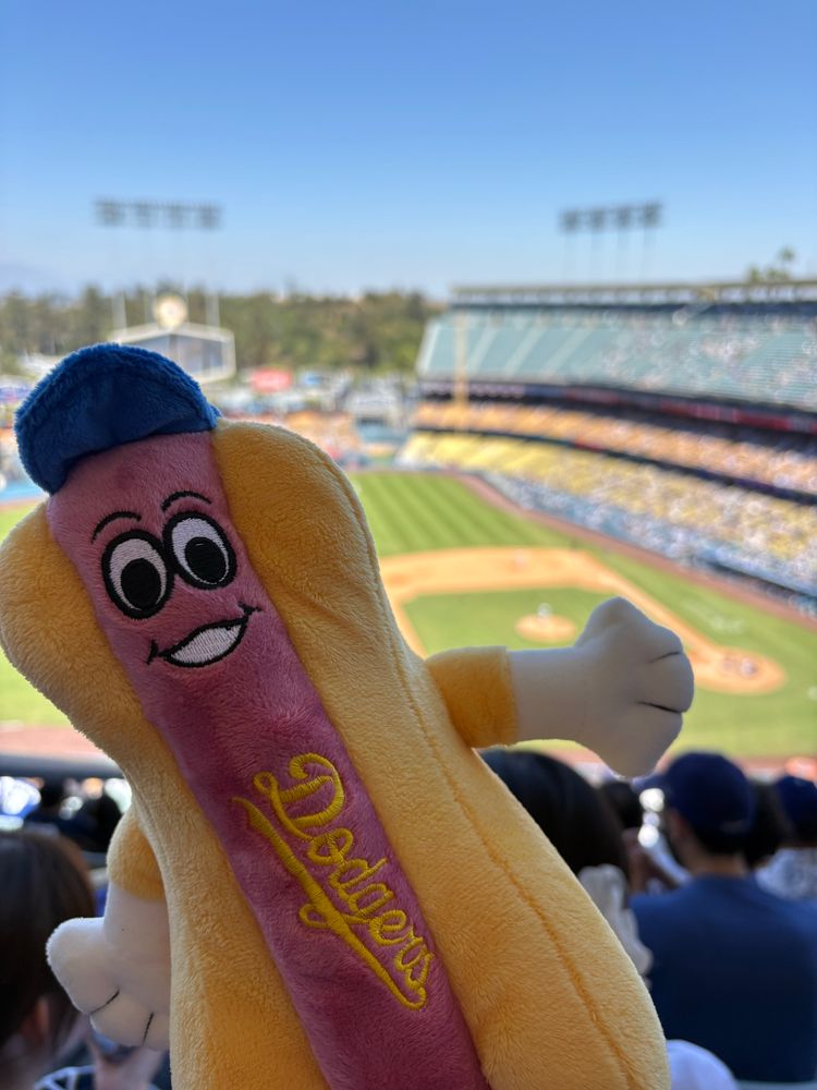 A smiling, stuffed Dodger Dog at Dodger Stadium 
