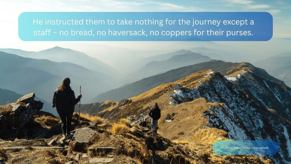 A back view of walkers on the top of a mountain ridge, looking out towards distant mountains in a hazy blue sky. The text reads: “He instructed them to take nothing for the journey except a staff – no bread, no haversack, no coppers for their purses."